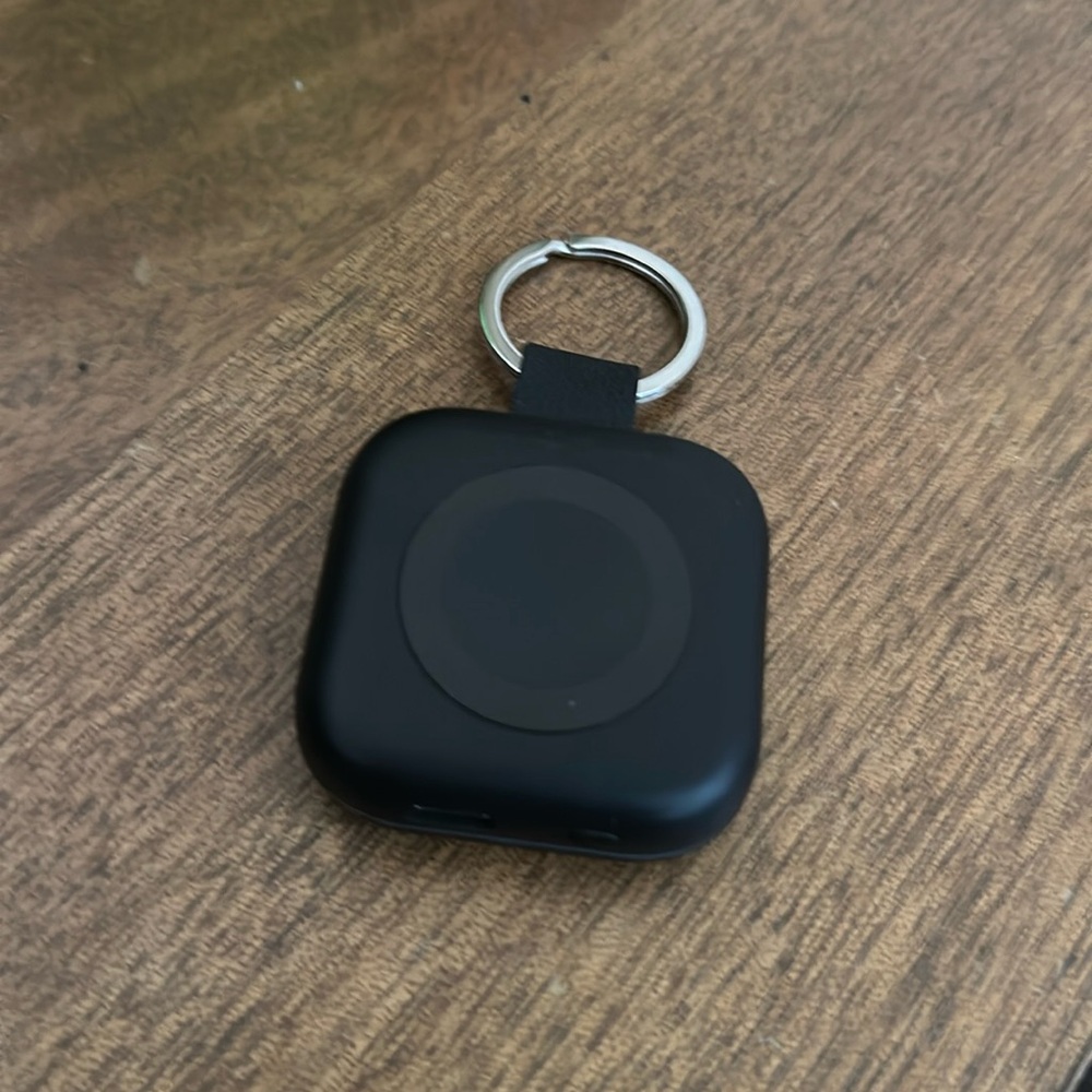 Travel charger compatible with Apple Watch.